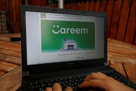 An employee shows an advertisement for ride-hailing company Careem, on a laptop in his office in the West Bank city of Ramallah July 17, 2017. Picture taken July 17, 2017. REUTERS/Mohamad Torokman - RC16480B7B00