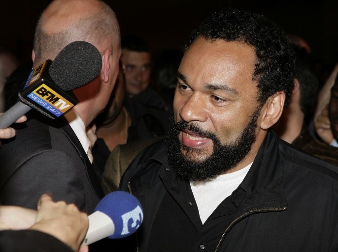 PARIS - APRIL 22: Controversial humorist Dieudonne M'Bala arrives to support the Front National's (FN) presidential candidate Jean-Marie Le Pen at the party election site following the first round of the French Presidential election on April 22, 2007 in Paris, France. With no candidate expected to gain a majority, the two leading candidates will likely face each other in a final round on May 6. (Photo by Francois Durand/Getty Images)