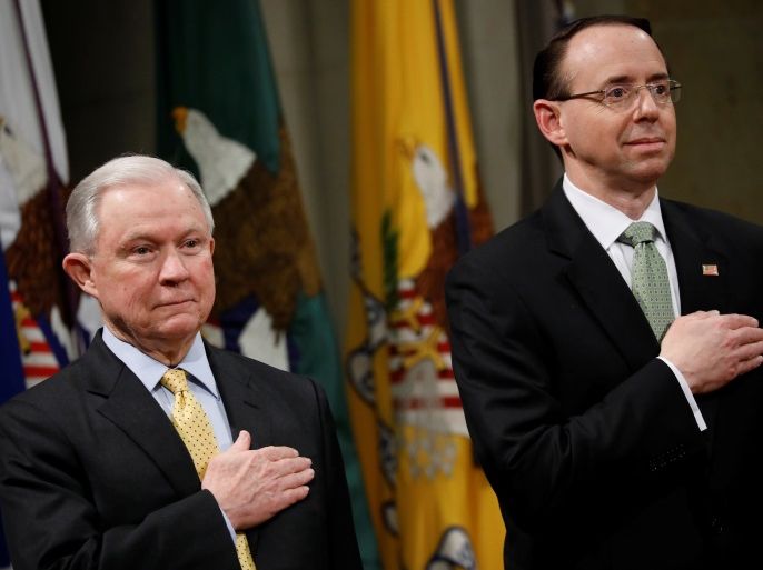 United States Attorney General Jeff Sessions (L) and Deputy Attorney General Rod Rosenstein stand for the pledge of allegiance at a summit about combating human trafficking at the Department of Justice in Washington, U.S., February 2, 2018. REUTERS/Aaron P. Bernstein