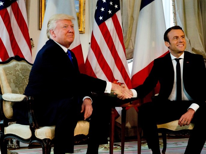 U.S. President Donald Trump (L) shakes hands with French President Emmanuel Macron before a working lunch ahead of a NATO Summit in Brussels, Belgium, May 25, 2017. REUTERS/Peter Dejong/Pool