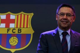 Barcelona's President Josep Maria Bartomeu is seen next to a FC Barcelona's logo during a charity Christmas event