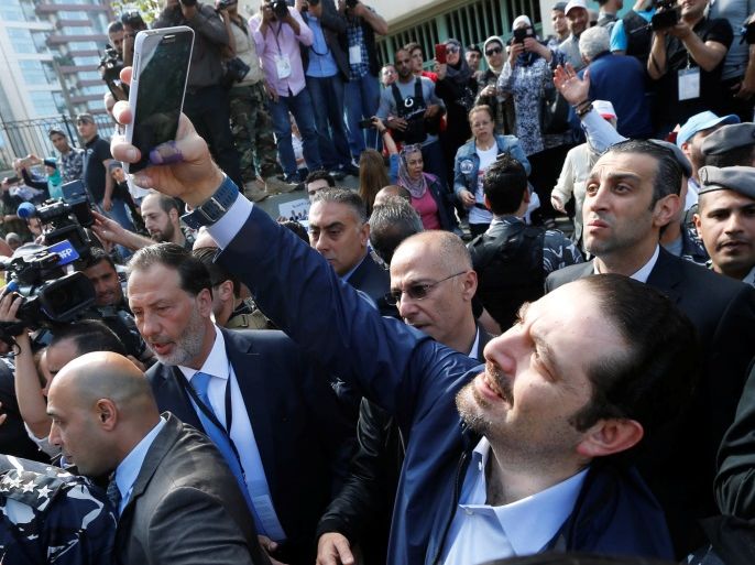 Lebanon's former Prime Minister Saad al-Hariri takes a selfie with his ink-stained thumb after casting his ballot at a polling station during Beirut's municipal elections, Lebanon, May 8, 2016. REUTERS/Mohamed Azakir