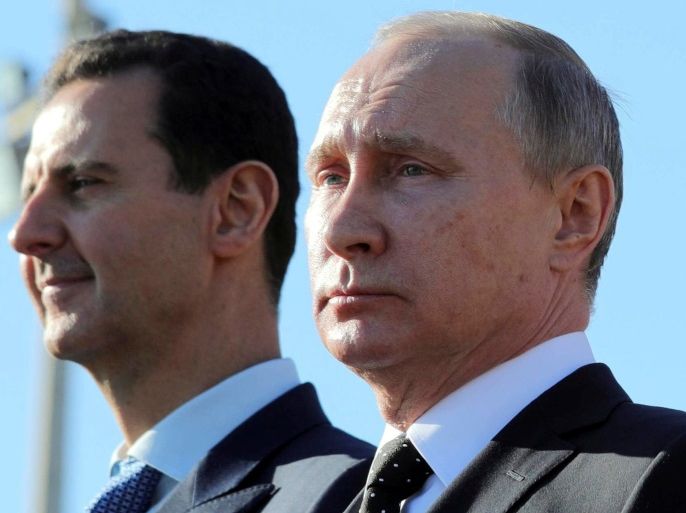 Russian President Vladimir Putin (R) and Syrian President Bashar al-Assad visit the Hmeymim air base in Latakia Province, Syria December 11, 2017. Picture taken December 11, 2017. To match Special Report RUSSIA-FLIGHTS/ Sputnik/Mikhail Klimentyev/ via REUTERS/File Photo ATTENTION EDITORS - THIS IMAGE WAS PROVIDED BY A THIRD PARTY.