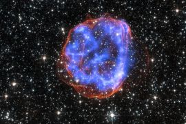 An expanding shell of debris called SNR 0519-69.0 is left behind after a massive star exploded in the Large Magellanic Cloud, a satellite galaxy to the Milky Way, as seen in this undated NASA handout image released January 23, 2015. Multimillion degree gas is seen in X-rays from Chandra, in blue. The outer edge of the explosion (red) and stars in the field of view are seen in visible light from the Hubble Space Telescope. REUTERS/NASA/CXC/SAO/Handout via Reuters (OUT