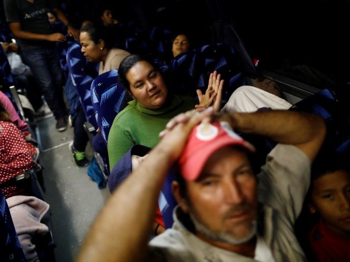 Central American migrants, moving in a caravan through Mexico and traveling to request asylum in U.S., are pictured inside a bus before their travel from Hermosillo to Mexicali, in Sonora state, Mexico April 23, 2018. REUTERS/Edgard Garrido