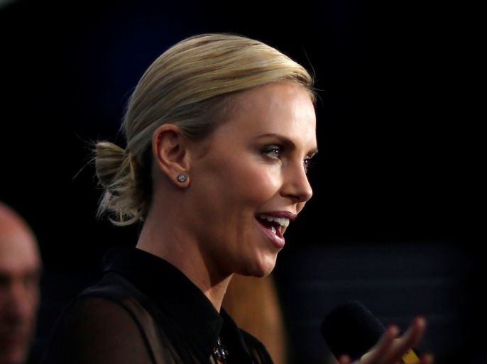 Cast member Charlize Theron is interviewed at the premiere for