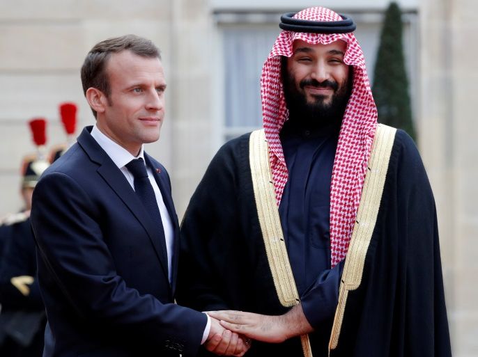 French President Emmanuel Macron welcomes Saudi Arabia's Crown Prince Mohammed bin Salman as he arrives at the Elysee Palace in Paris, France, April 10, 2018. REUTERS/Philippe Wojazer