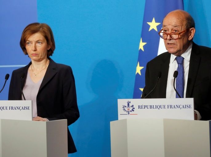 French Minister for Foreign Affairs Jean-Yves Le Drian and French Minister of the Armed Forces Florence Parly make an official statement in the press room at the Elysee Palace, in Paris, France, April 14, 2018. The French military on Saturday targeted Syria's main chemicals research centre as well as two other facilities, hours after President Emmanuel Macron ordered a military intervention in Syria alongside the United States and Britain in an attack on the chemical weapons arsenal. Michel Euler/Pool via Reuters