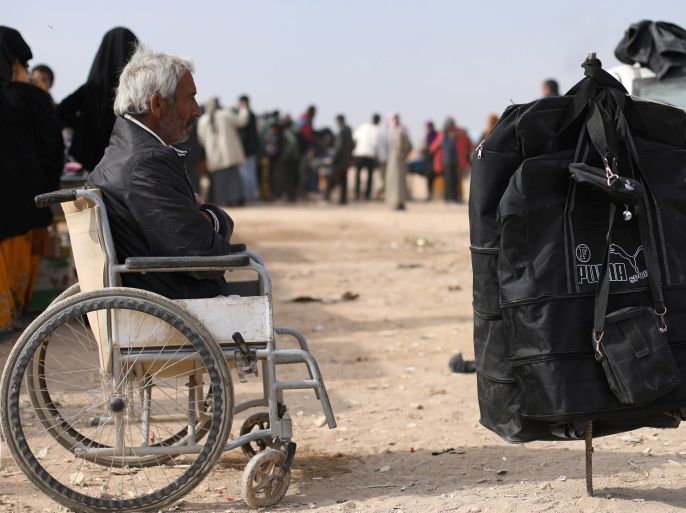 An internally displaced man who fled Deir al-Zor is seen on a wheelchair at Qana refugee camp in southern Hasakah, Syria November 26, 2017. REUTERS/Rodi Said