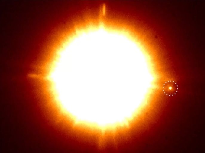 An infrared image of the binary star system CS Cha, taken by the SPHERE instrument on the European Southern Observatory's Very Large Telescope in Chile. The newly discovered companion is in the dotted circle.