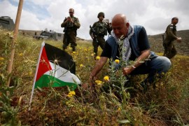 A Palestinian man plants an olive tree during a protest against Jewish settlements and ahead of the 70th anniversary of Nakba, near Ramallah, in the occupied West Bank May 13, 2018. REUTERS/Mohamad Torokman