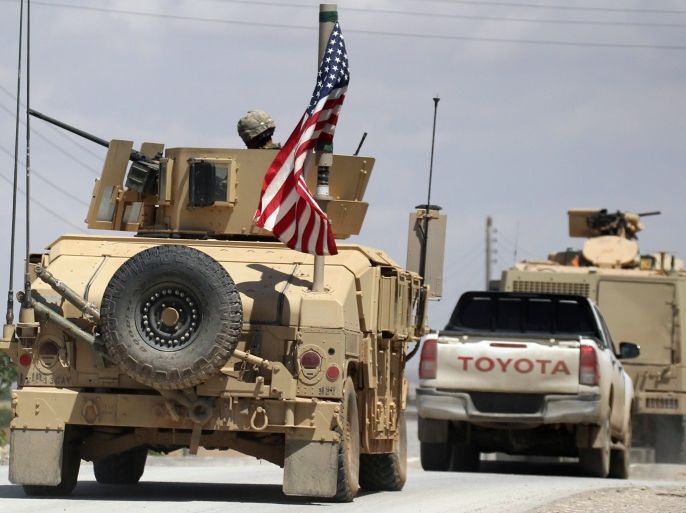 The U.S. flag flutters on a military vehicle in Manbej countryside, Syria May 12, 2018. REUTERS/Aboud Hamam