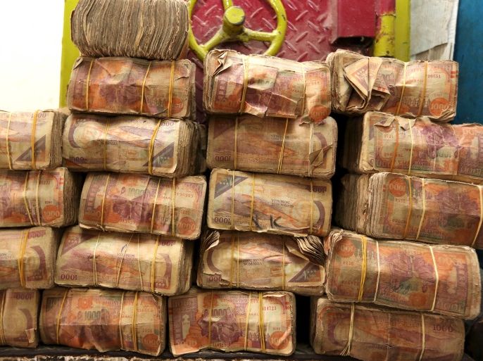Bundles of Somalian currency (shillings) are seen displayed at an open-air forex bureau along Hamarweyne district of in Somalia's capital Mogadishu, January 27, 2016. Picture taken January 27, 2016. To match SOMALIA-ECONOMY/ REUTERS/Feisal Omar