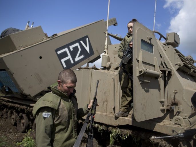 GOLAN HEIGHTS, ISRAEL - MARCH 16: A female Israeli soldier is seen on a M270 Multiple Launch Rocket System during an army drill on March 16, 2016 in Israeli-annexed Golan Heights. Israeli President Reuven Rivlin landed in Moscow last night and on Wednesday begins talks with Russian leaders including President Vladimir Putin. Rivlin bears the distinction of being the first foreign leader to meet with the president since Putin announced the withdrawal of most Russian for