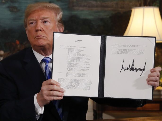 U.S. President Donald Trump displays a presidential memorandum after announcing his intent to withdraw from the JCPOA Iran nuclear agreement in the Diplomatic Room at the White House in Washington, U.S., May 8, 2018. REUTERS/Jonathan Ernst