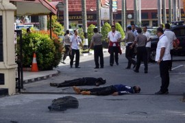 ATTENTION EDITORS - VISUAL COVERAGE OF SCENES OF INJURY OR DEATH The bodies of two attackers who were shot and killed are seen at the entrance of a police station in Pekanbaru, Indonesia May 16, 2018 in this photo taken by Antara Foto. Antara Foto/ Retmon/ via REUTERS ATTENTION EDITORS - THIS IMAGE WAS PROVIDED BY A THIRD PARTY. MANDATORY CREDIT. INDONESIA OUT. NO COMMERCIAL OR EDITORIAL SALES IN INDONESIA. TEMPLATE OUT.