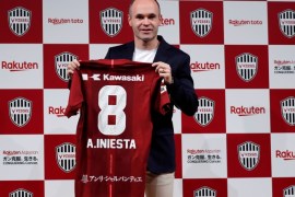 Spain midfielder Andres Iniesta poses with his new team jersey at a news conference to announce signing for J-League side Vissel Kobe in Tokyo, Japan May 24, 2018. REUTERS/Toru Hanai