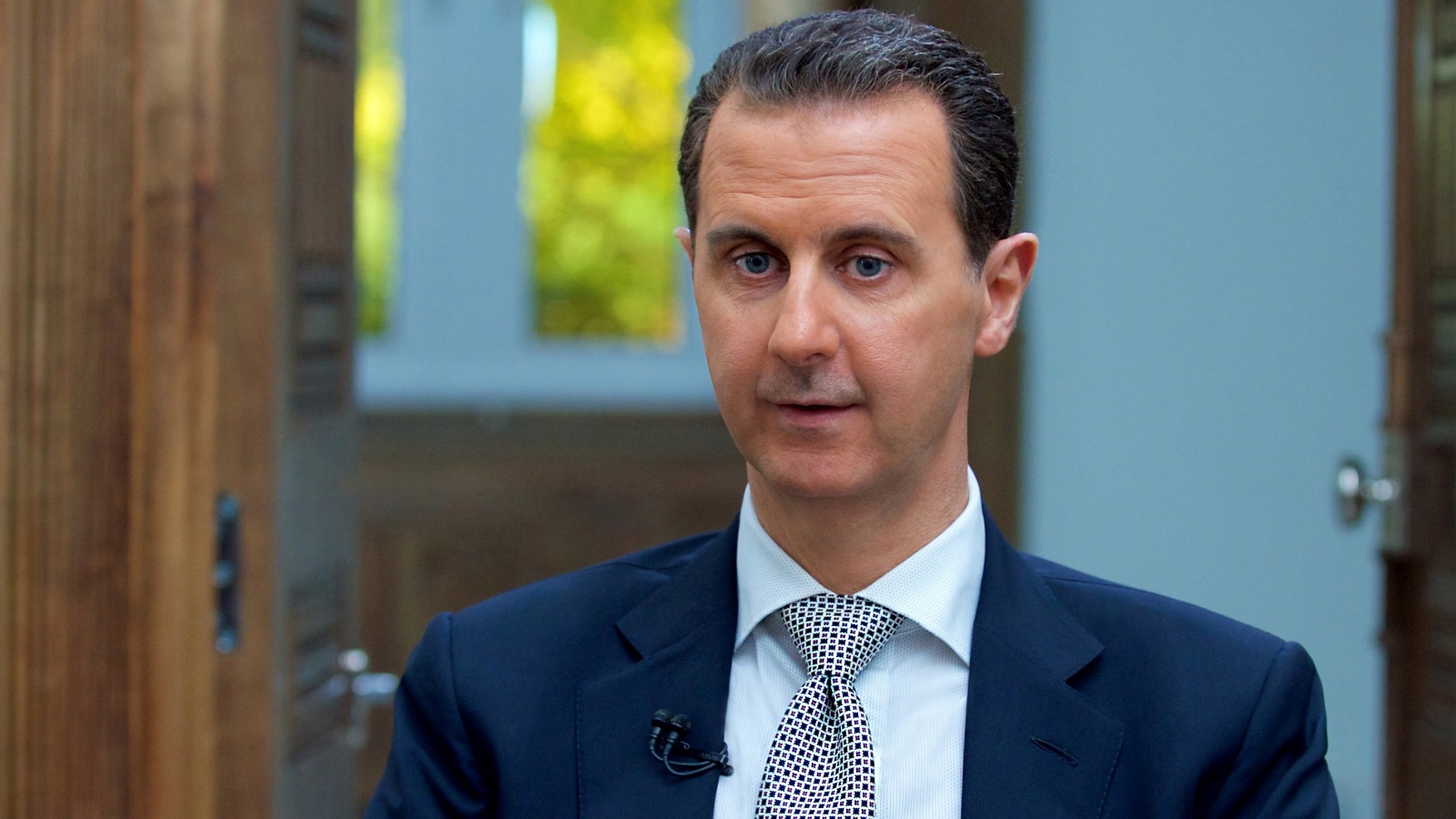 ‪‬ الأسد دافع عن القانون وأكد أنه لا يحرم أحدا من ملكيته