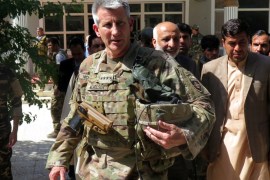 U.S. Army General John Nicholson, commander of Resolute Support forces and U.S. forces in Afghanistan, walks with Afghan officials during an official visit in Farah province, Afghanistan May 19, 2018. Picture taken May 19, 2018. REUTERS/James Mackenzie