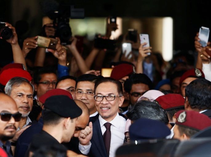 Malaysian politician Anwar Ibrahim leaves a hospital where he is receiving treatment, ahead of an audience with Malaysia's King Sultan Muhammad V, in Kuala Lumpur, Malaysia May 16, 2018. REUTERS/Lai Seng Sin