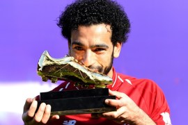 LIVERPOOL, ENGLAND - MAY 13: Mohamed Salah of Liverpool pose for a photo with his Premier League Golden Boot Award after the Premier League match between Liverpool and Brighton and Hove Albion at Anfield on May 13, 2018 in Liverpool, England. (Photo by Michael Regan/Getty Images)