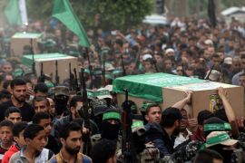 Palestinians carry bodies of Hamas militants who were killed in an explosion, during their funeral in the central Gaza Strip May 6, 2018. REUTERS/Ibraheem Abu Mustafa