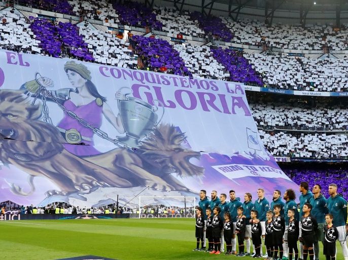 Soccer Football - Champions League Semi Final Second Leg - Real Madrid v Bayern Munich - Santiago Bernabeu, Madrid, Spain - May 1, 2018 Real Madrid players line up before the match as fans display a banner REUTERS/Kai Pfaffenbach TPX IMAGES OF THE DAY