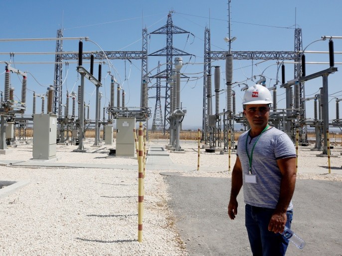 An Israeli engineer stands in the new electrical substation near the West Bank city of Jenin July 10, 2017. REUTERS/Abed Omar Qusini
