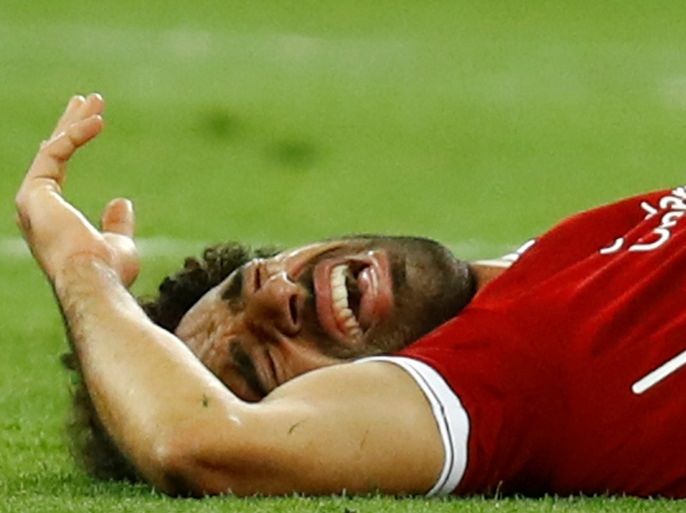 Soccer Football - Champions League Final - Real Madrid v Liverpool - NSC Olympic Stadium, Kiev, Ukraine - May 26, 2018 Liverpool's Mohamed Salah reacts after sustaining an injury REUTERS/Kai Pfaffenbach