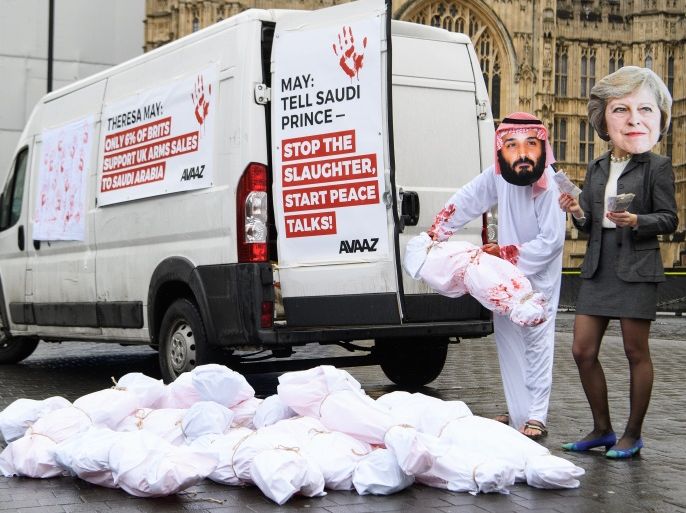 LONDON, ENGLAND - MARCH 07: Protest group Avaaz stages a demonstration against the ongoing violence in Yemen, with actors dressed as British Prime Minister Theresa May (R) and Saudi Crown Prince Mohammed bin Salman (L) outside the Houses of Parliament on March 7, 2018 in London, England. Saudi Crown Prince Mohammed bin Salman, who is currently taking part in a three-day UK visit, has made wide-ranging changes at home supporting a more liberal Islam. Whilst visiting the