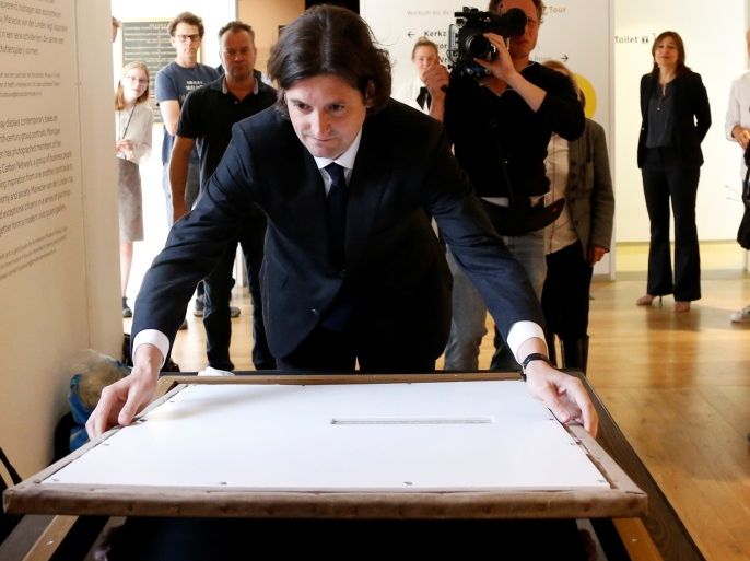 Dutch art dealer Jan Six places a Rembrandt painting called