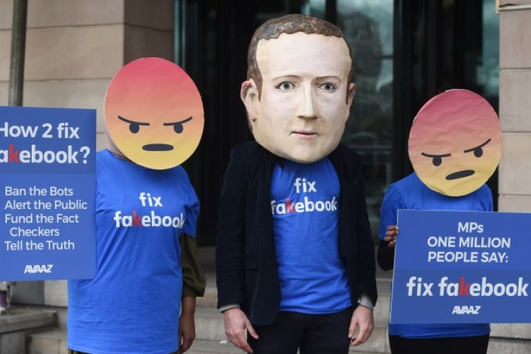 epa06693776 A protester wearing a mask depicting Facebook's CEO, Mark Zuckerberg, flanked by two protesters wearing angry emoji masks protest outside Portcullis House in central London, Britain, 26 April 2018. Facebook’s CTO Mike Schroepfer's is scheduled to appear at Portcullis House infront of British Members of Parliament on the Digital, Culture, Media and Sport Select Committee in the wake of allegations that information on millions of its users was misused. EPA-E