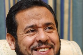Libya's Islamist military chief Abdel Hakim Belhadj smiles during an interview with Reuters at the a hotel in Tripoli, November 11, 2011. Sitting for a Reuters interview on Friday clad in a sharp blue suit and open-necked shirt, many Libyans might need a double-take to recognise Belhadj, now he has shed his trademark military fatigues and wants to assure his many critics that his Islamist agenda is inclusive and democratic. Declining to be pinned down on his personal ambitions - beyond indicating he does not want an immediate role as defence minister - he insisted he bore no grudge against Western powers who he says colluded in his torture under Gaddafi, dismissed talk of links to al Qaeda and refused to be drawn on rivals' accusations that he is a pawn in Qatari plans to control Libya. To match Interview LIBYA/ISLAMIST-BELHAJ REUTERS/Youssef Boudlal (LIBYA) (POLITICS MILITARY)