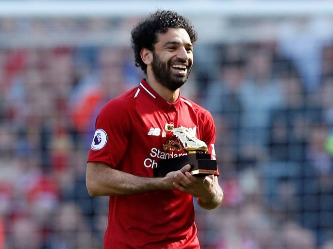 Soccer Football - Premier League - Liverpool vs Brighton & Hove Albion - Anfield, Liverpool, Britain - May 13, 2018 Liverpool's Mohamed Salah celebrates with the Golden Boot after the match Action Images via Reuters/Carl Recine EDITORIAL USE ONLY. No use with unauthorized audio, video, data, fixture lists, club/league logos or