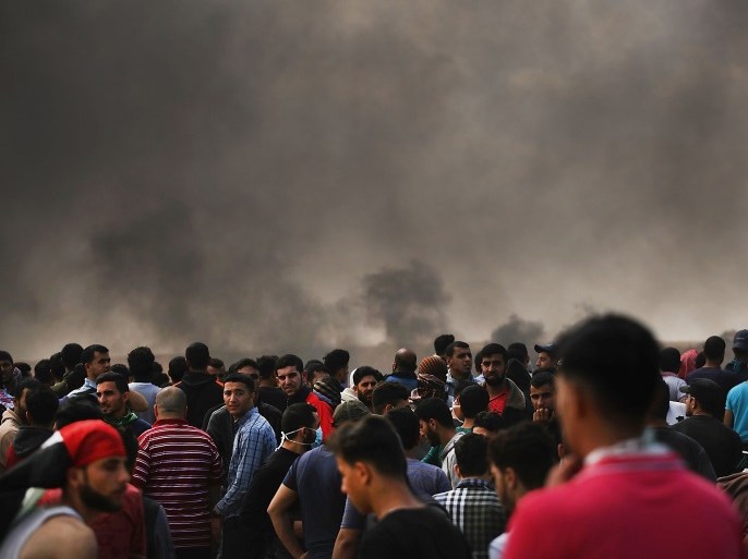GAZA CITY, GAZA - MAY 14: Thousands of Palestinians stand along the border fence with Israel as mass demonstrations continue on May 14, 2018 in Gaza City, Gaza. Israeli soldiers killed at least 52 Palestinians and wounded over a thousand as the demonstrations coincided with the controversial opening of the U.S. Embassy in Jerusalem. This marks the deadliest day of violence in Gaza since 2014. Gaza's Hamas rulers have vowed that the marches will continue until the deca