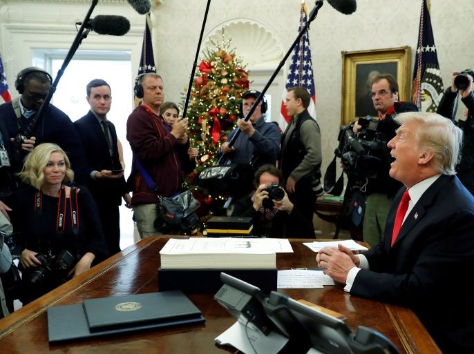 U.S. President Donald Trump delivers remarks after signing sweeping tax overhaul legislation into law in the Oval Office at the White House in Washington, U.S. December 22, 2017. REUTERS/Jonathan Ernst TPX IMAGES OF THE DAY