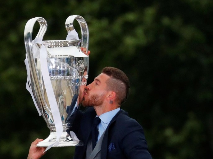 Soccer Football - Real Madrid celebrate winning the Champions League Final - Madrid, Spain - May 27, 2018 Real Madrid's Sergio Ramos celebrates with the trophy during victory celebrations REUTERS/Paul Hanna