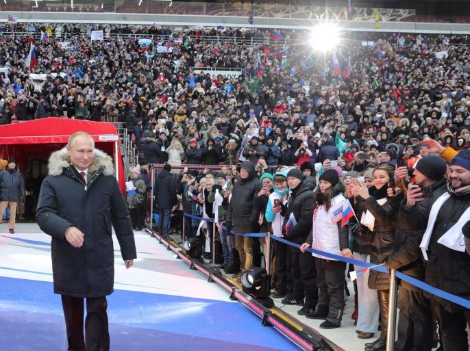 Russian President Vladimir Putin arrives to take part in a rally to support his bid in the upcoming presidential election, at Luzhniki Stadium in Moscow, Russia March 3, 2018. Sputnik/Mikhail Klimentyev/Kremlin via REUTERS ATTENTION EDITORS - THIS IMAGE WAS PROVIDED BY A THIRD PARTY.