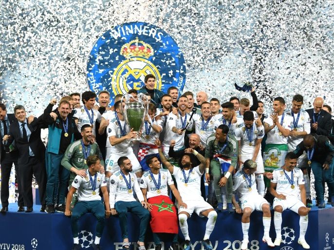 KIEV, UKRAINE - MAY 26: Real Madrid players celebrate victory with the trophy after the UEFA Champions League Final between Real Madrid and Liverpool at NSC Olimpiyskiy Stadium on May 26, 2018 in Kiev, Ukraine. (Photo by Shaun Botterill/Getty Images)