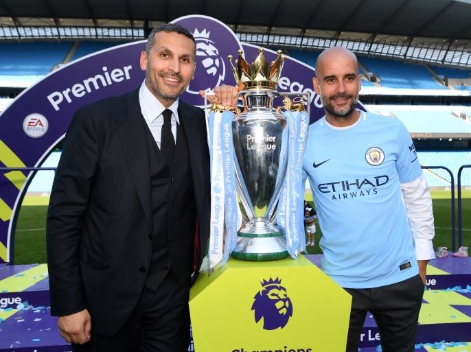 MANCHESTER, ENGLAND - MAY 06: Khaldoon al-Mubarak, Manchester City chairman and Josep Guardiola, Manager of Manchester City pose with the Premier League trophy as Manchester City win the Premier League after the Premier League match between Manchester City and Huddersfield Town at Etihad Stadium on May 6, 2018 in Manchester, England. (Photo by Michael Regan/Getty Images)
