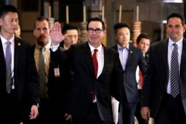 U.S. Treasury Secretary Steven Mnuchin, a member of the U.S. trade delegation to China, waves to the media as he returns to a hotel in Beijing, China May 3, 2018. REUTERS/Jason Lee