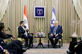 Paraguayan President Horacio Cartes sits next to Israeli President Reuven Rivlin at his residence in Jerusalem, ahead of the dedication ceremony of the embassy of Paraguay in Jerusalem, May 21, 2018. REUTERS/Ronen Zvulun