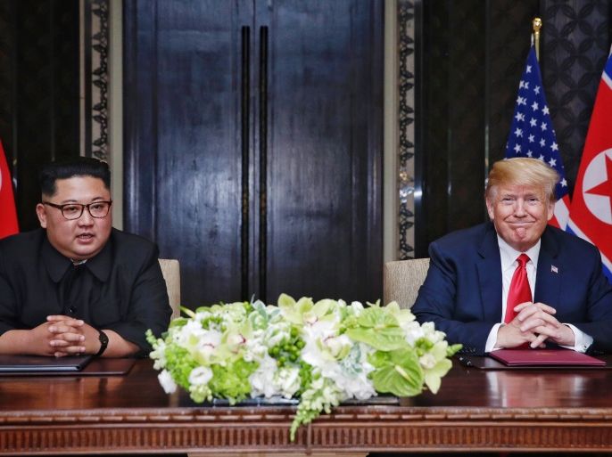 SINGAPORE, SINGAPORE - JUNE 12: In this handout photograph provided by The Strait Times,, North Korean leader Kim Jong-un (L) with U.S. President Donald Trump (R) during their historic U.S.-DPRK summit at the Capella Hotel on Sentosa island on June 12, 2018 in Singapore. U.S. President Trump and North Korean leader Kim Jong-un held the historic meeting between leaders of both countries on Tuesday morning in Singapore, carrying hopes to end decades of hostility and the
