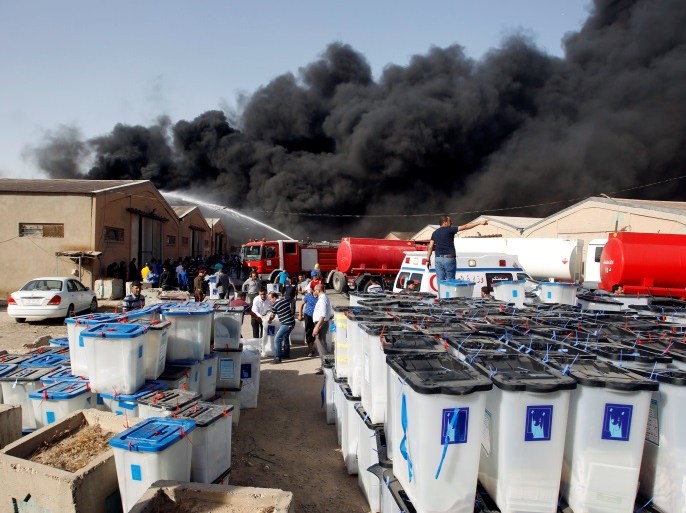 Smoke rises from a storage site in Baghdad, housing ballot boxes from Iraq's May parliamentary election, Iraq June 10, 2018. REUTERS/Khalid al-Mousily