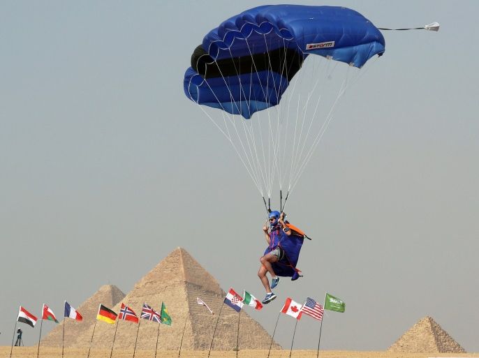 A parachuter takes part in the Air Games near the Giza Pyramids on the outskirts of Cairo, Egypt April 28, 2018. REUTERS/Mohamed Abd El Ghany