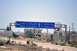 A road sign that shows the direction to the town of al-Harak is pictured in Alma, in Deraa province, Syria in this handout released on June 29, 2018. SANA/Handout via REUTERS ATTENTION EDITORS - THIS PICTURE WAS PROVIDED BY A THIRD PARTY. REUTERS IS UNABLE TO INDEPENDENTLY VERIFY THE AUTHENTICITY, CONTENT, LOCATION OR DATE OF THIS IMAGE