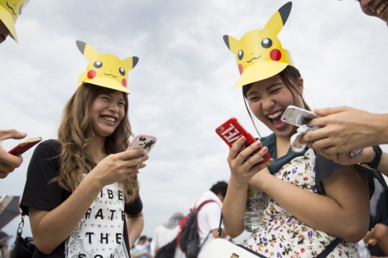 YOKOHAMA, JAPAN - AUGUST 09: People play Nintendo Co.'s Pokemon Go augmented reality game on their smartphones during the Pikachu Outbreak event hosted by The Pokemon Co. on August 9, 2017 in Yokohama, Kanagawa, Japan. A total of 1, 500 Pikachus appear at the city's landmarks in the Minato Mirai area aiming to attract visitors and tourists to the city. The event will be held through until August 15. (Photo by Tomohiro Ohsumi/Getty Images)