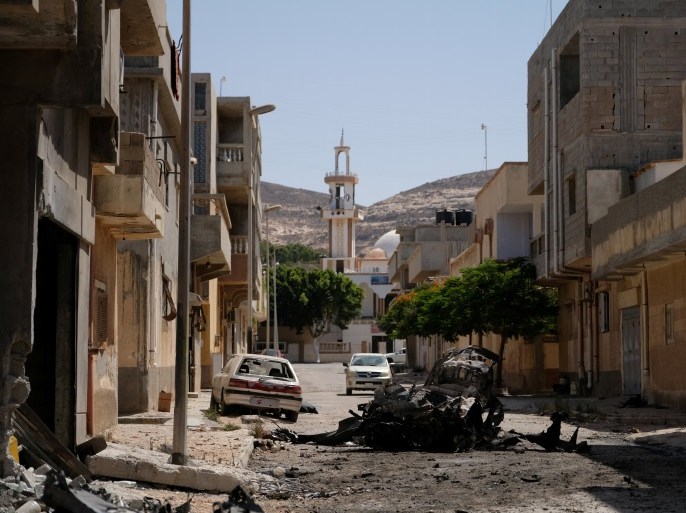 A view of destroyed buildings and cars after forces loyal to Libyan commander Khalifa Haftar took control of the area, in Derna, Libya June 13, 2018. Picture taken June 13, 2018. REUTERS/Esam Omran Al-Fetori