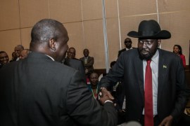South Sudan President Salva Kiir (R) greets South Sudan Rebel leader Riek Machar during the 32nd Extra-Ordinary Summit of IGAD Assembly of Heads of State and Government in Addis Ababa, Ethiopia June 21, 2018. Presidential Press Service/Handout via REUTERS ATTENTION EDITORS - THIS IMAGE WAS PROVIDED BY A THIRD PARTY.