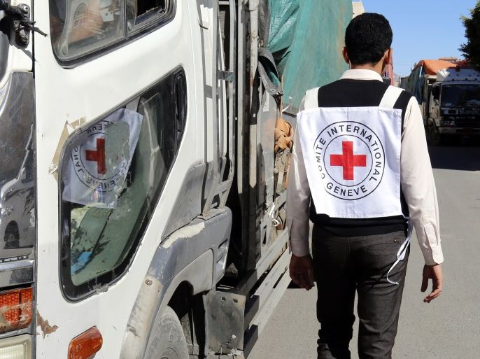 epa06791768 (FILE) - A member of staff from the International Committee of the Red Cross passes a truck carrying ICRC-provided emergency medical aid, in Sana’a, Yemen, 13 December 2017 (issued 07 June 2018). According to reports, the International Committee of the Red Cross (ICRC) has pulled 71 staff members out of Yemen amid rising insecurity in the war-torn Arab country. EPA-EFE/YAHYA ARHAB